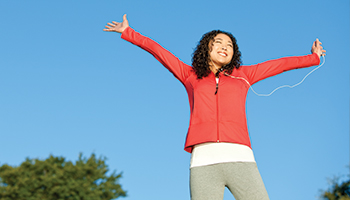 Woman jumping with headphones