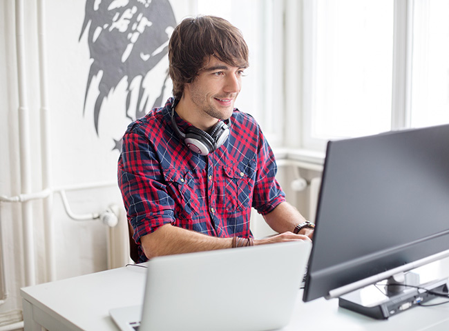 A student uses a laptop to send an email.