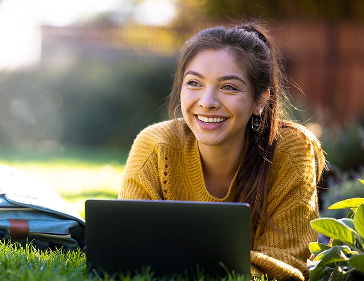 young women with laptop outdoors