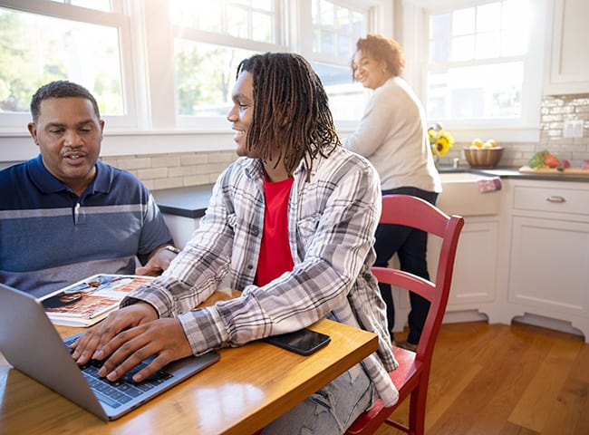 A student and his family discuss paying for college.