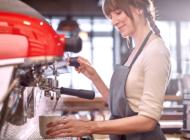 A student learns how to pay off student loans by working as a barista.